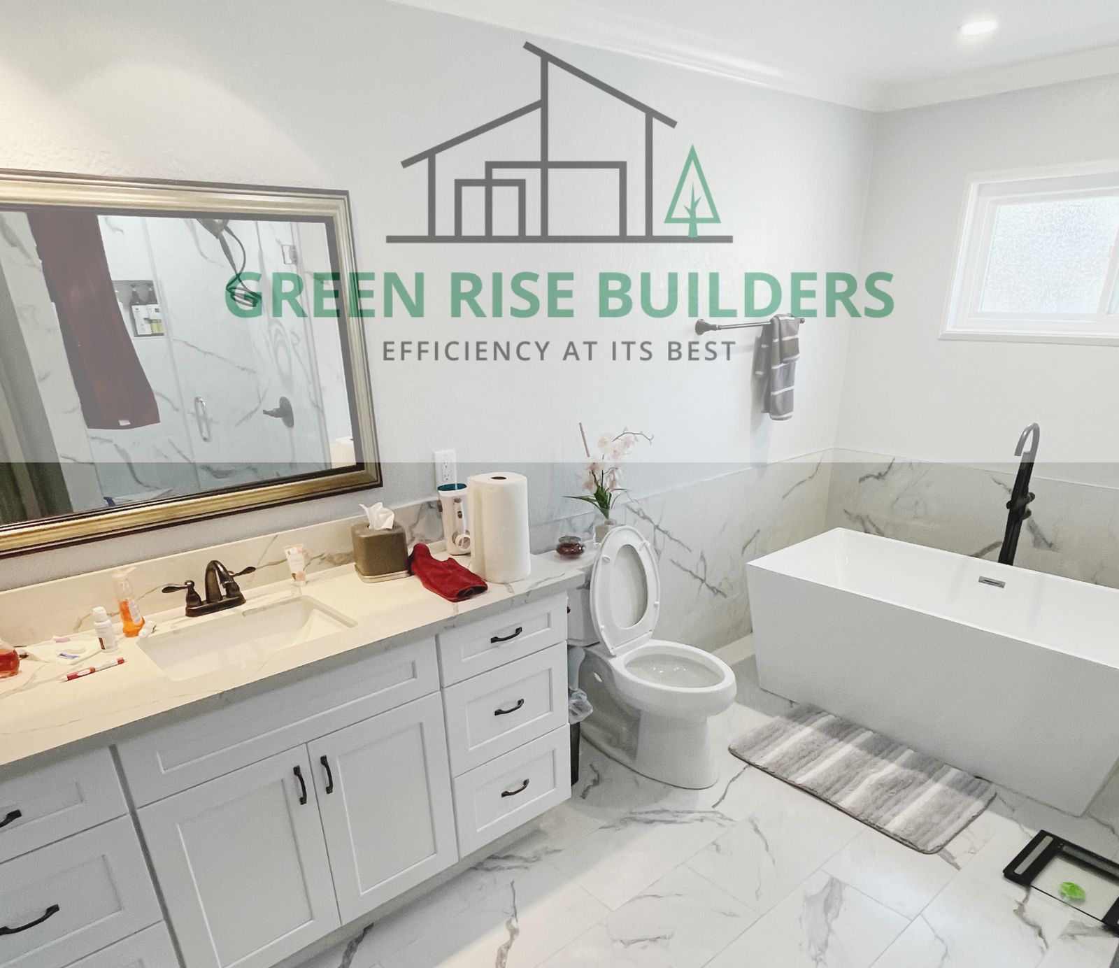 Marble bathroom remodel with freestanding tub by Green Rise Builders